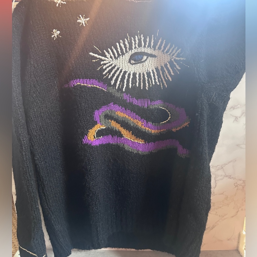 Designer Raquel Allegra evil eye sweater